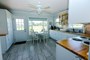 Full downstairs kitchen with views of the pasture and access to private patio!