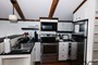 A second full kitchen provides more ways to stay  connected or share with others in your group!