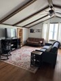 Relax and connect in your large open concept living area, with 2 futons for extra sleeping!